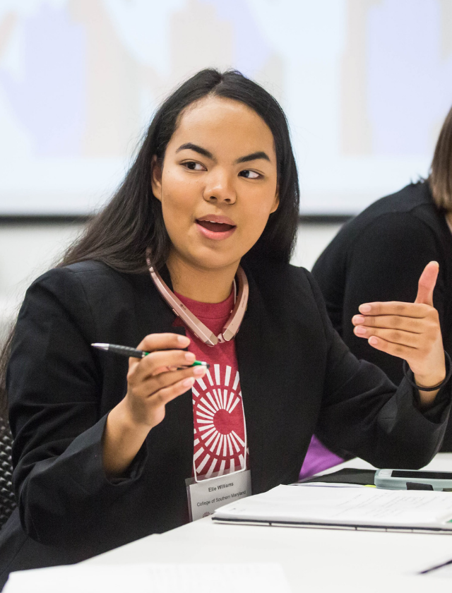 student wearing campus compact shirt