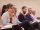 attendees sit in chairs at a conference