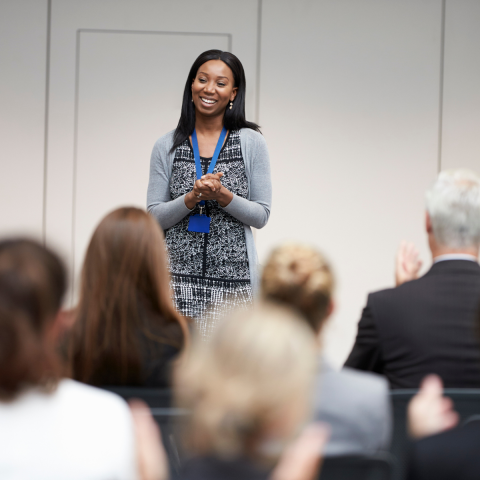 person speaking in front of an audience