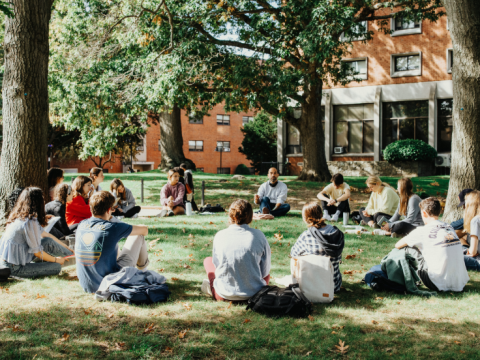 students sitting on college campus