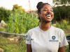 woman smiling while wearing americorps t-shirt