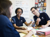 group of americorps members work together at table