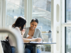 two people meeting at a small table