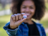 person holding a vote button